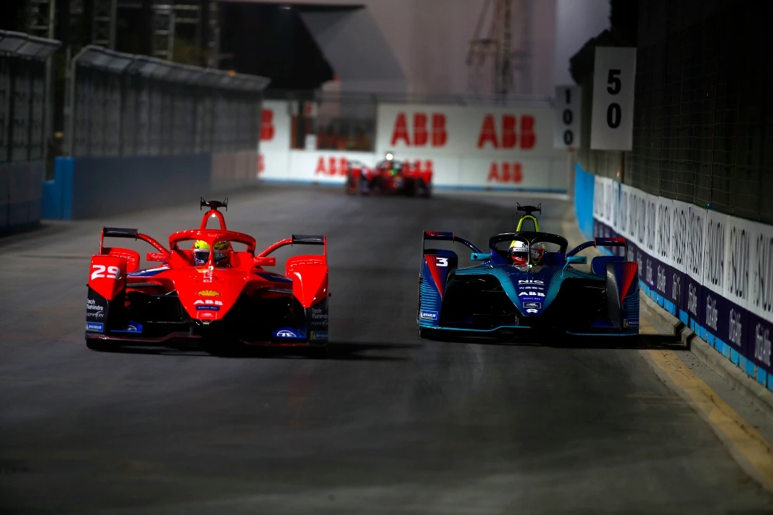 Alexander Sims (GBR) of Mahindra Racing, overtakes Oliver Turvey (GBR) of NIO 333 Racing at Riyadh Street Circuit during the Diriyah E-Prix in January. (Sam Bloxham/LAT Images)