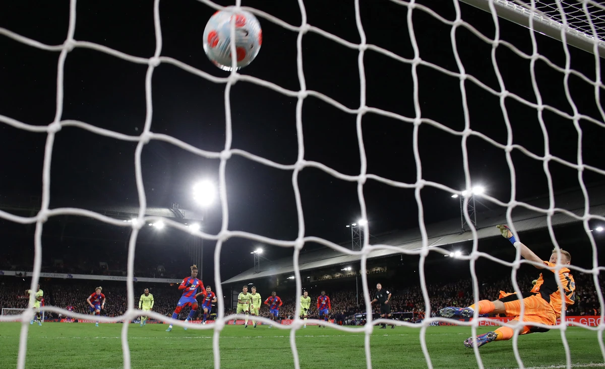 Crystal Palace's Wilfried Zaha scores their third goal from the penalty spot past Arsenal's Aaron during thir Premier League clash Monday at Ramsdale Selhurst Park, London. (Reuters)