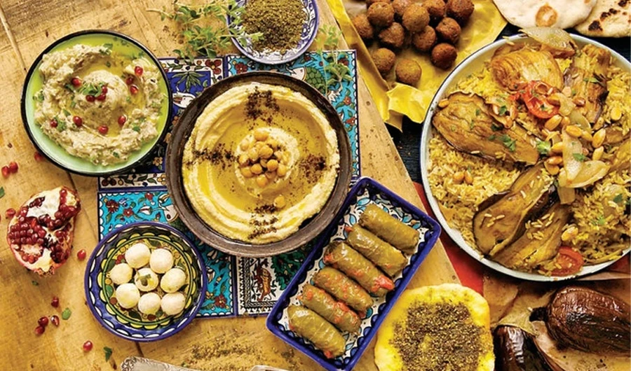 With constant unrest and displacement, refugees from different Palestinian cities share their cities’ famous dishes with one another. Maqluba, the national dish of Palestine, is enjoyed by all. (Supplied)