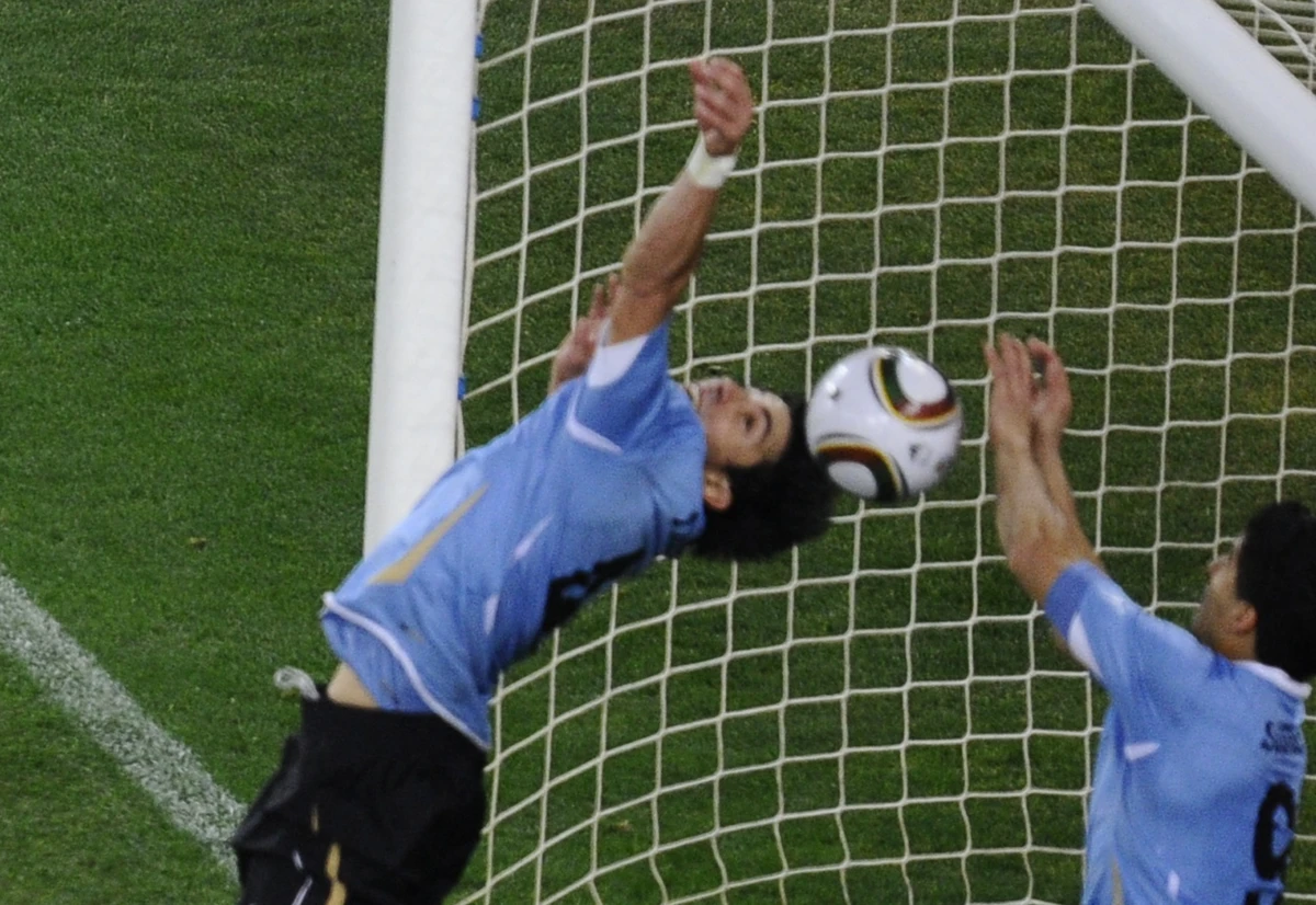 Few supporters from Ghana, or around the world, will have forgotten Luis Suarez’s 120th-minute goal-line handball, and subsequent penalty miss by Asamoah Gyan. (AFP)