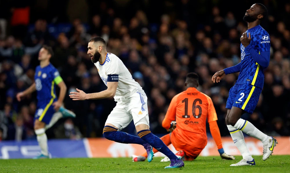 Real Madrid's Karim Benzema celebrates scoring their third goal as Chelsea's Antonio Rudiger looks dejected. (Reuters)