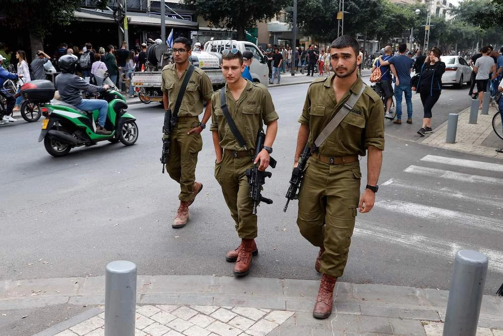 Israelis soldiers patrol the centre of Israel's Mediterranean coastal city of Tel Aviv on April 8, 2022, a day after the attack. (AFP)