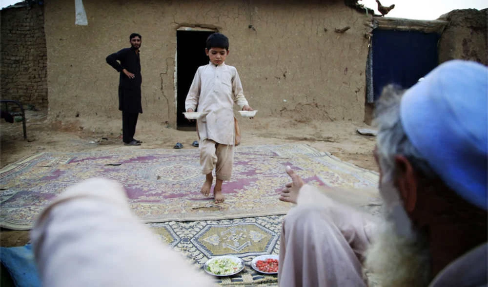Afghan refugees break their fast at a refugee camp in Islamabad, Pakistan, on June 19, 2015. (Getty Images)