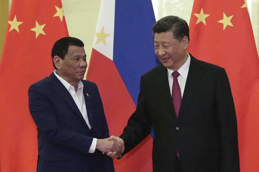 Philippine President Rodrigo Duterte, left, with Chinese President Xi Jinping before their meeting in Beijing on April 25, 2019. Duterte has pursued warmer ties with China since taking office in 2016. (AFP)