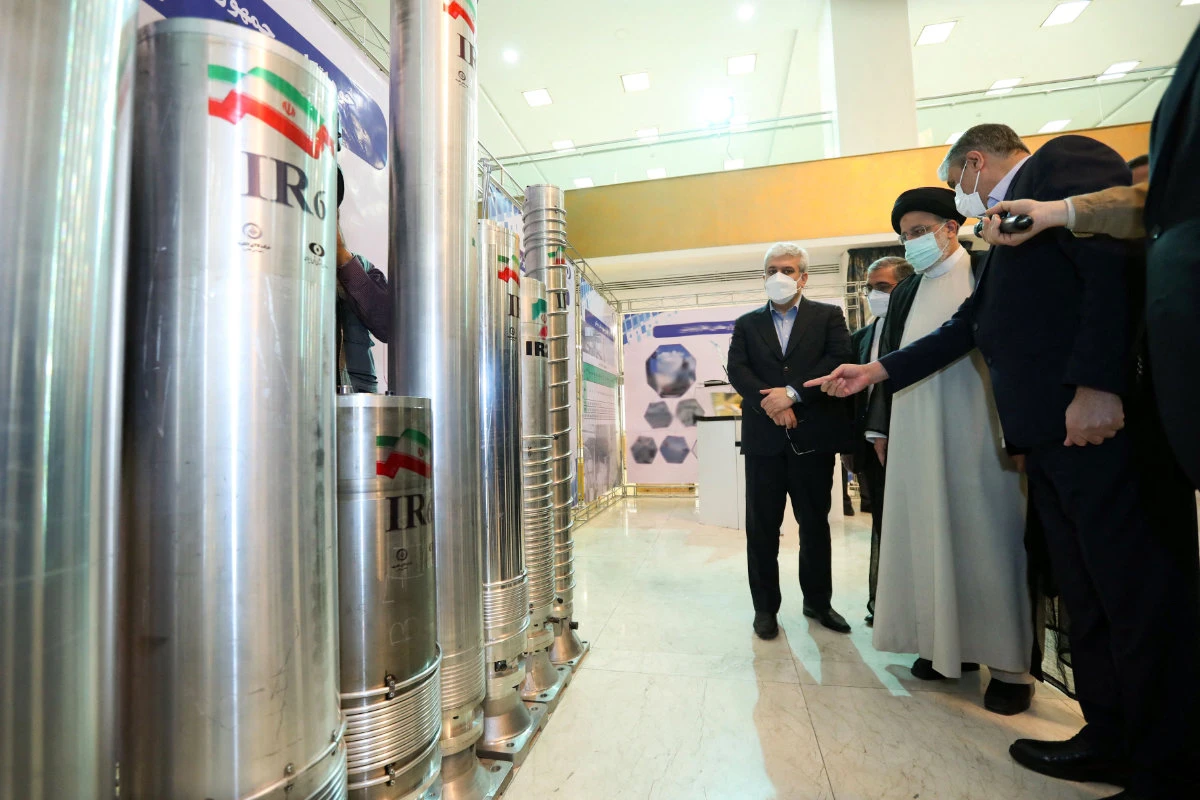 Iranian President Ebrahim Raisi (2-R) attending an event during the "Nuclear Technology Day" in Tehran on April 9, 2022. (Iranian Presidency handout via AFP)