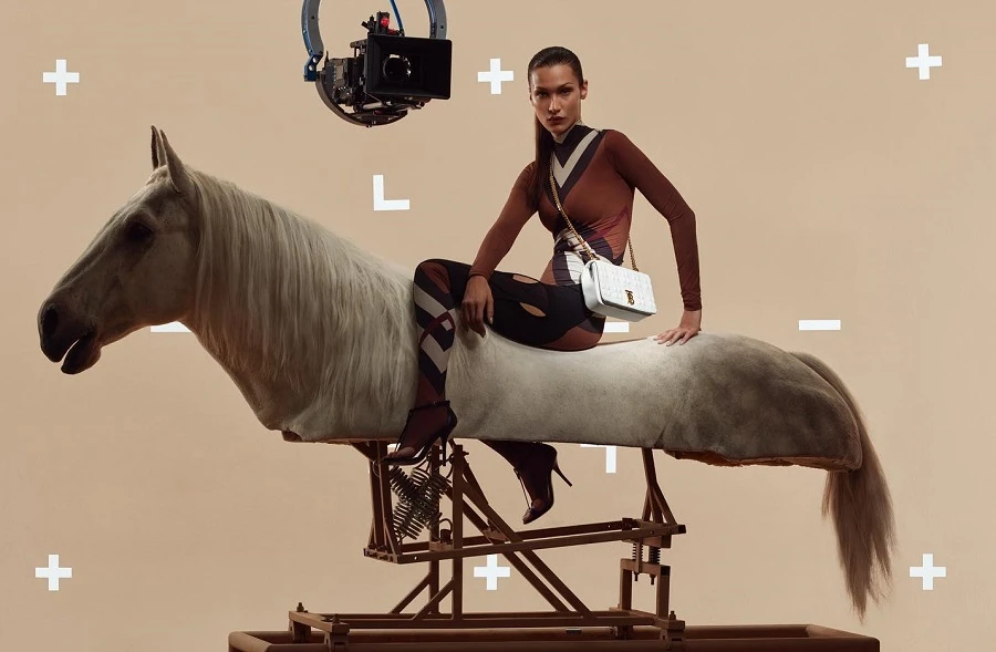 In the ad, she rides a half-cut horse figure toting the new product. Supplied