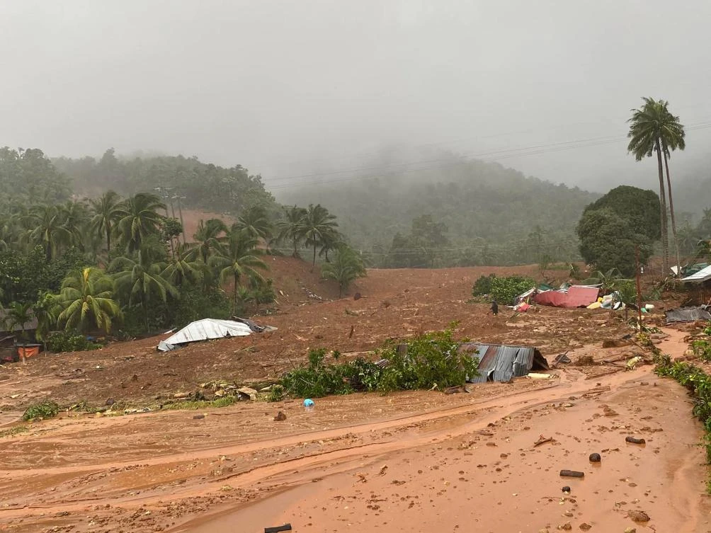 Houses are buried under mud after a landslide hit the village of Bunga, in Baybay town, Southern Leyte province, southern Philippines, following heavy rains brough about by Tropical storm Agaton. (AFP)