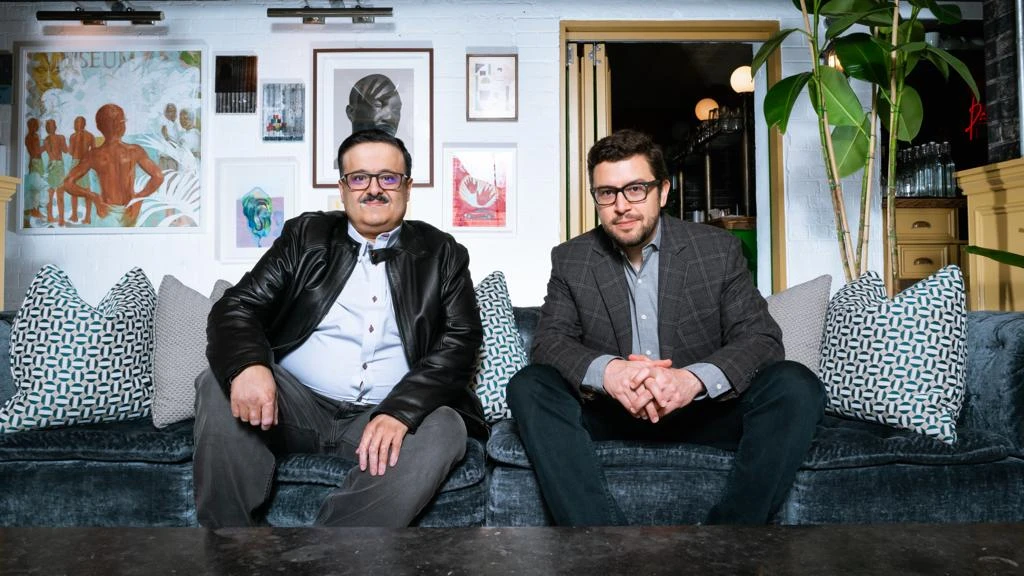 Kooora signing with Khalid Aldoseri (left) and Juan Delgado (right). (Supplied)