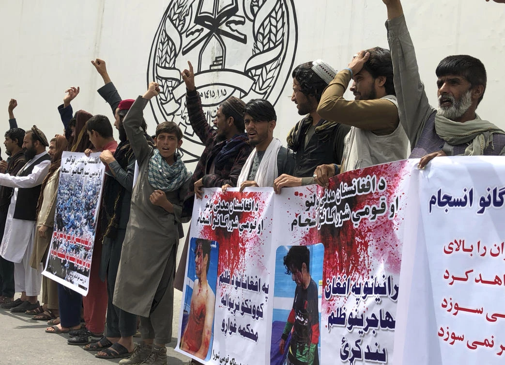 Afghans chant slogans against Iran during a demonstration in in Massoud Square, Kabul, Afghanistan, Tuesday, April 12, 2022. (AP Photo/Mohammed Shoaib Amin)