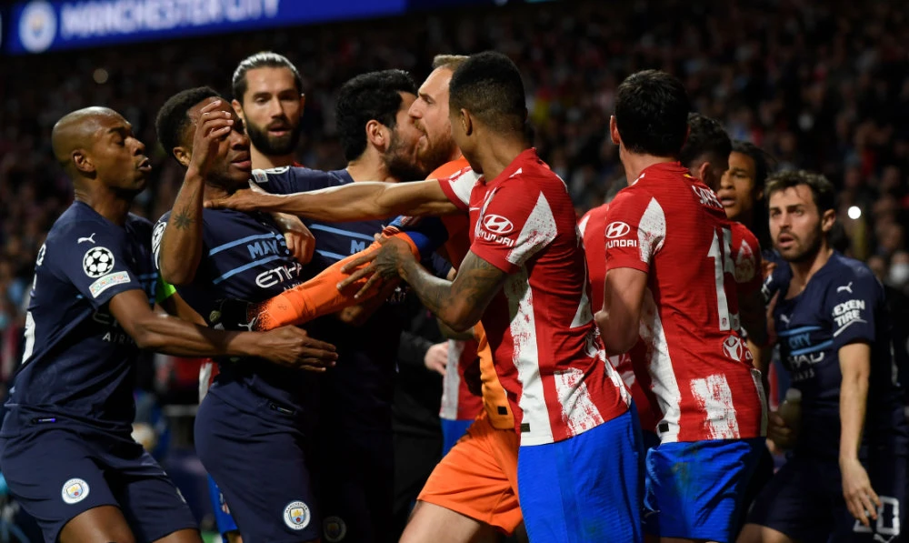 Players fight during the UEFA Champions League quarterfinal second leg football match between Atletico de Madrid and Manchester City at the Wanda Metropolitano stadium in Madrid on April 13, 2022. (AFP)