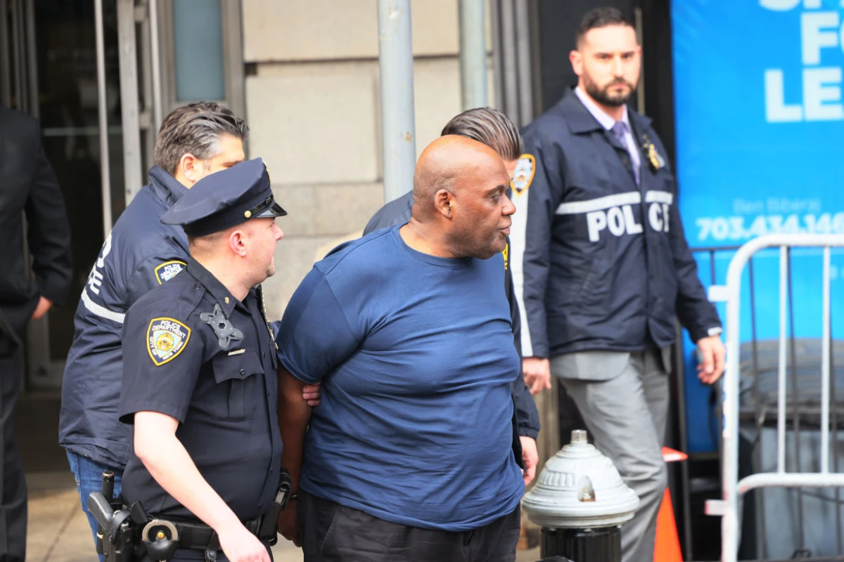 Suspect Frank James is led by police after being arrested for his connection to the mass shooting at the 36th St subway station on April 13, 2022 in New York City. (Michael M. Santiago/Getty Images/AFP)