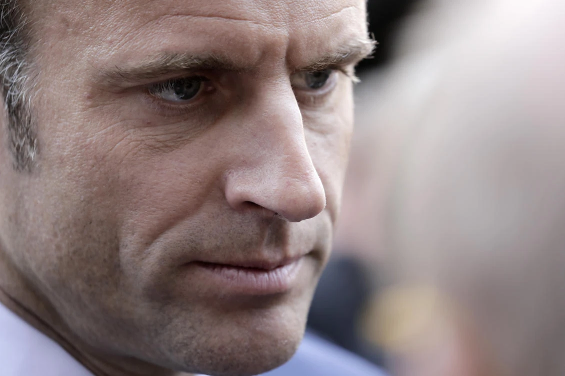 French President Emmanuel Macron and his far-right challenger Marine Le Pen have traded barbs ahead of a run-off vote set to be much closer than their 2017 contest. (AP)