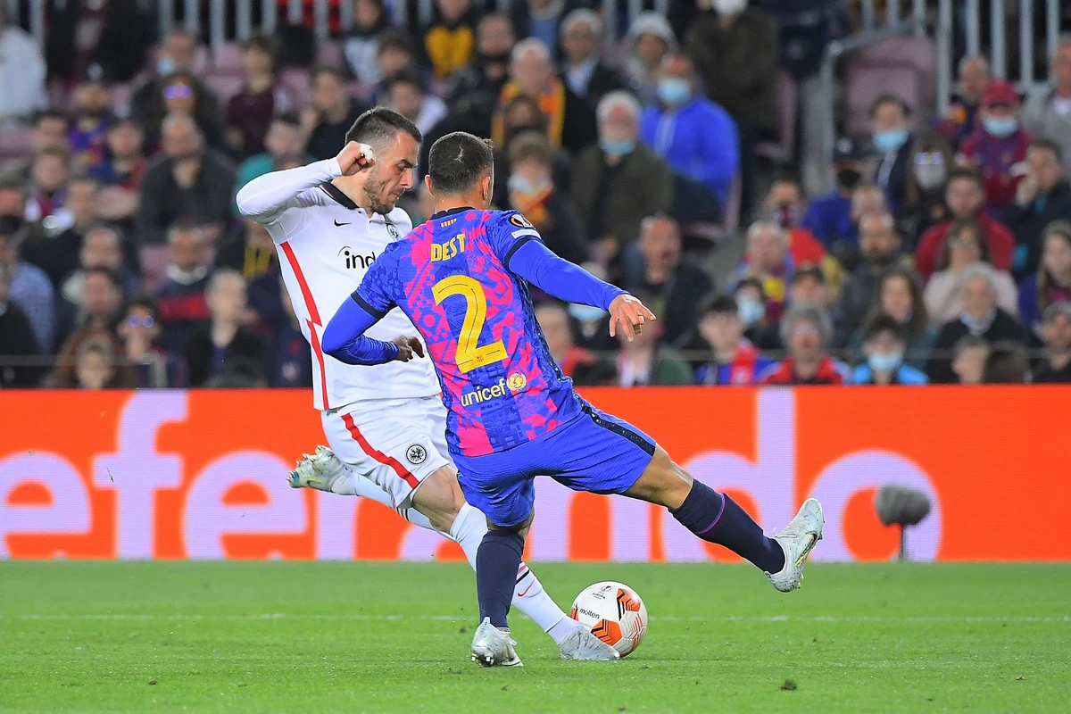 Eintracht Frankfurt's Serbian midfielder Filip Kostic scores a goal during the Europa League quarterfinal second leg football match against FC Barcelona in Barcelona on April 14, 2022. (AFP)