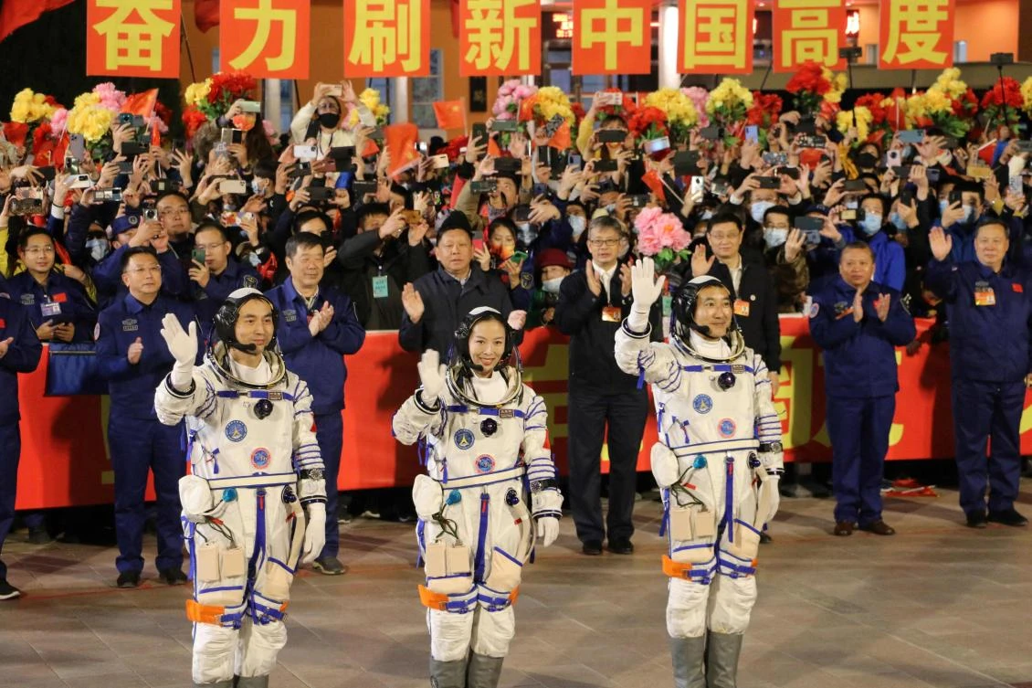(L-R) Astronauts Ye Guangfu, Wang Yaping and Zhai Zhigang before departure. (AFP/File)