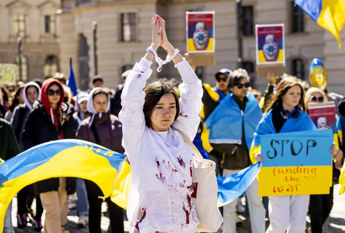 People attend a pro-Ukrainian protest under the slogan “March for true Peace in Ukraine,” in Berlin, on Saturday. (AP)