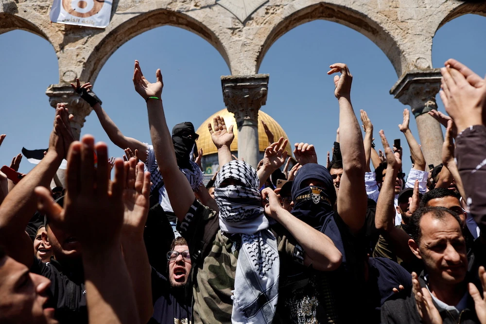 Palestinians shout slogans at the compound that houses Al-Aqsa Mosque, known to Muslims as Noble Sanctuary and to Jews as Temple Mount, following clashes with Israeli security forces in Jerusalem's Old City. (Reuters)n Jerusalem's Old City. (Reuters)