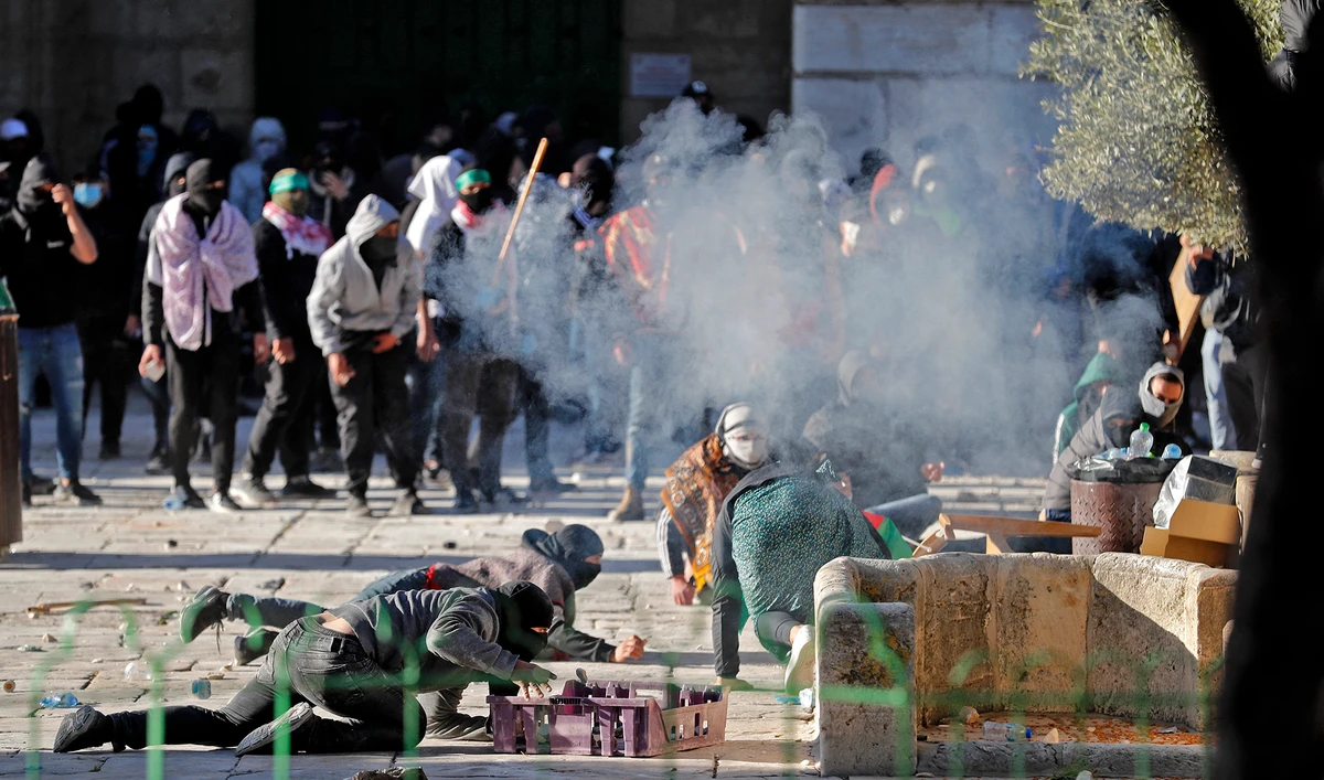 Palestinian demonstrators clash with Israeli police at Jerusalem's Al-Aqsa mosque compound on April 15, 2022. (AFP/File)