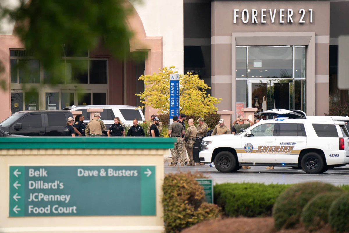 Law enforcers gather outside Columbiana Centre mall in Columbia, South Carolina, following a shooting on April 16, 2022. (AP Photo/Sean Rayford)