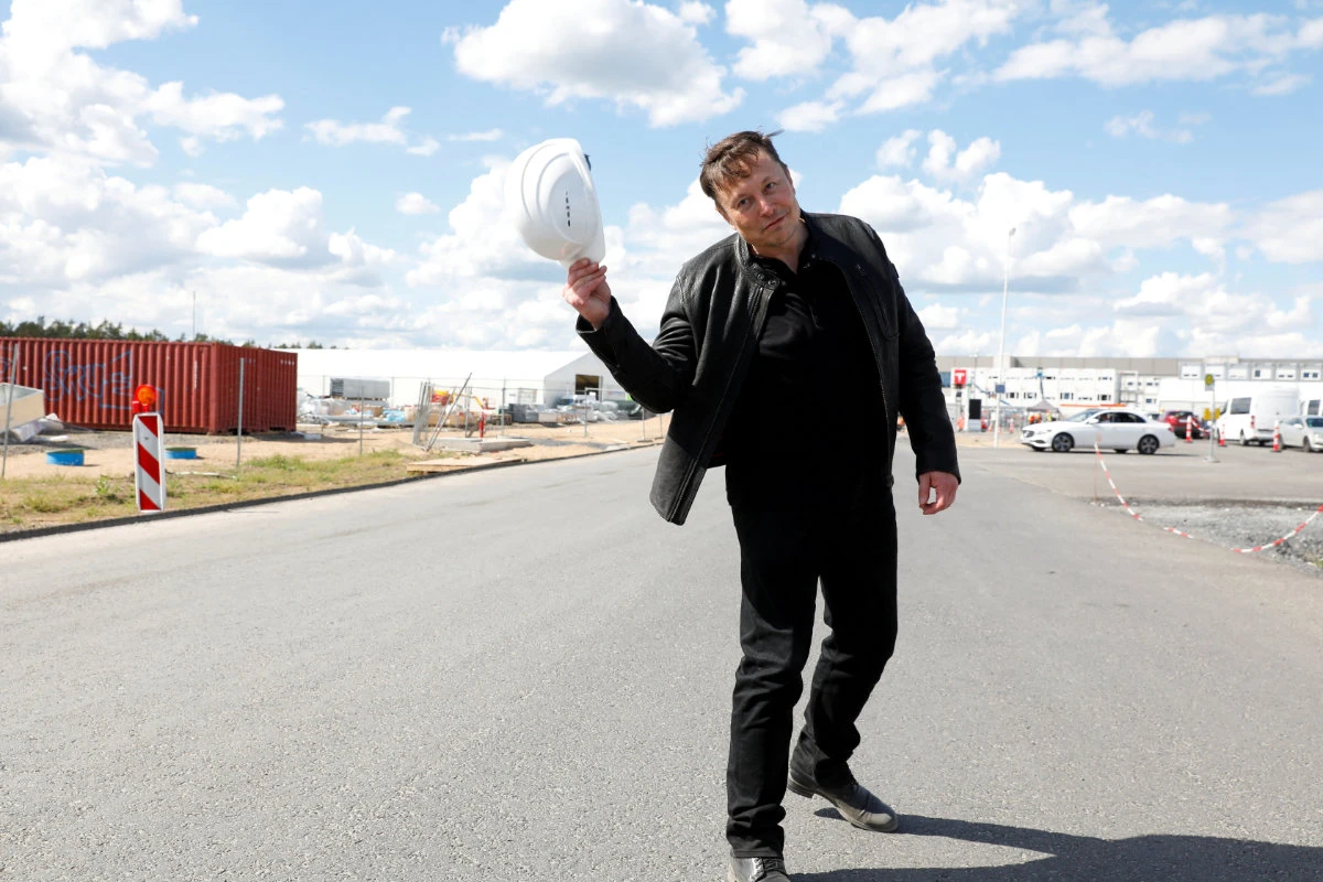 Tesla CEO Elon Musk holds a helmet as he visits the construction site of Tesla's gigafactory in Gruenheide, near Berlin, Germany, May 17, 2021. (REUTERS/File Photo)
