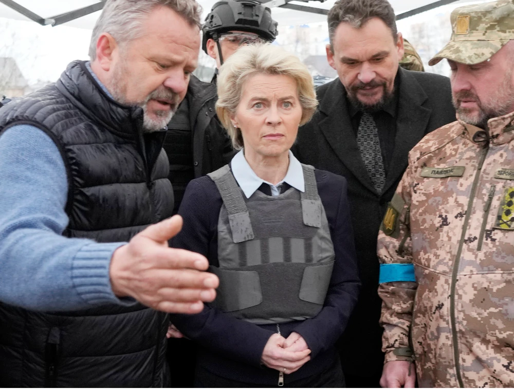 EU Commission President Ursula von der Leyen, center, visits a mass grave in Bucha, outskirts of Kyiv, Ukraine, Friday, April 8, 2022. (AP)