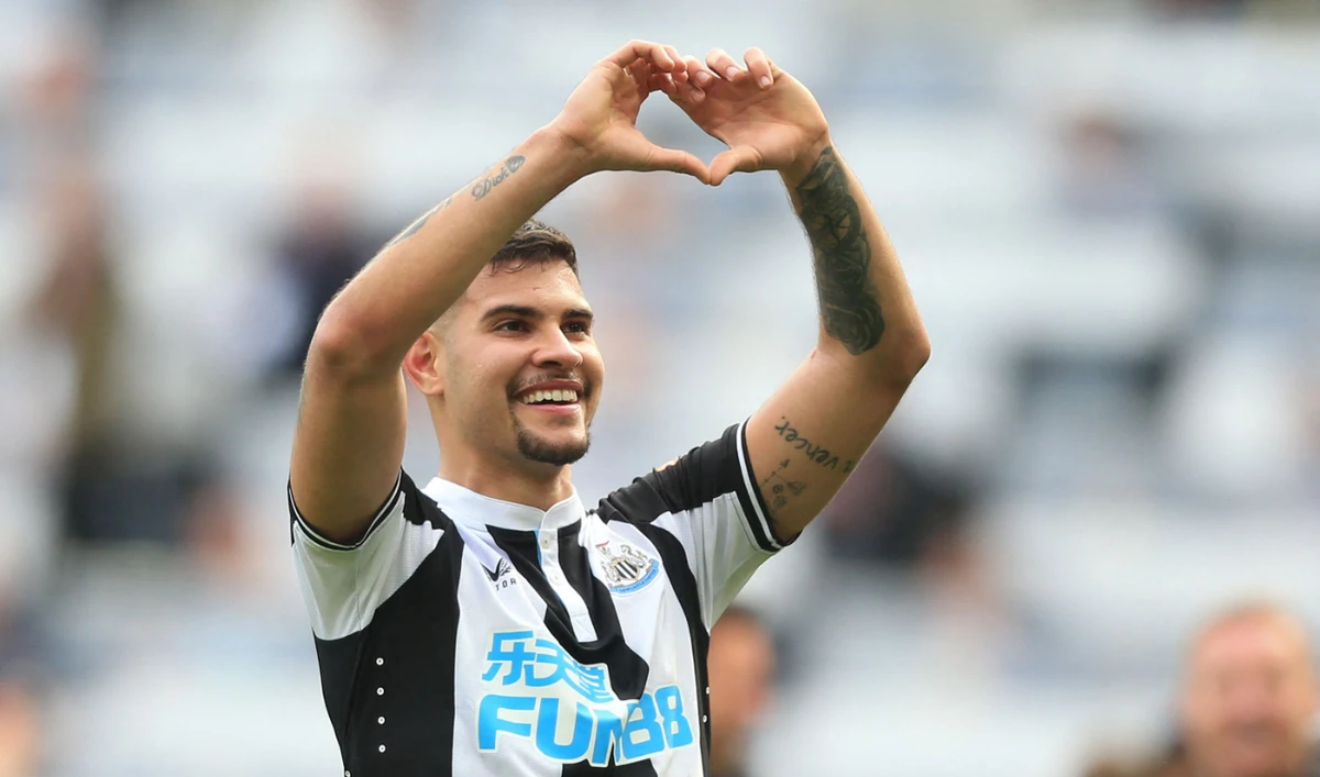 Newcastle United's Brazilian midfielder Bruno Guimaraes celebrates on the pitch after the English Premier League football match between Newcastle United and Leicester City on April 17, 2022. (AFP)