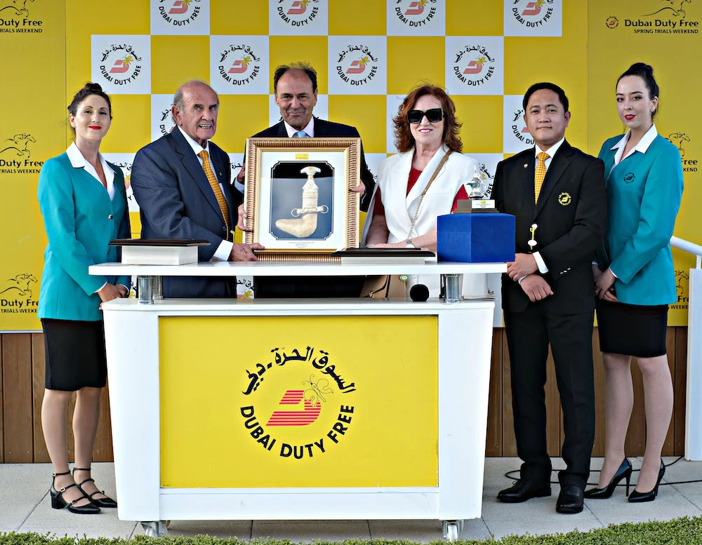 Godolphin Stud Director Liam O’Rourke receives the trophy for the Group 3 Dubai Duty Free Stakes at Newbury. (DDF)