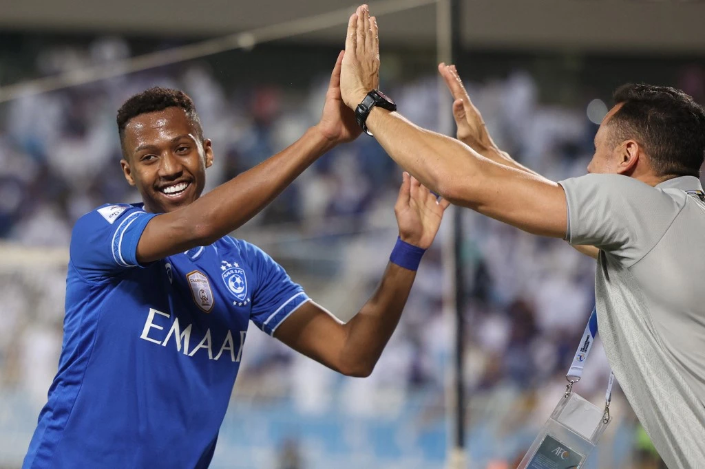 Al-Hilal midfielder Nasser Al-Dawsari celebrates after a goal during the AFC Champions League group A match against Qatar’s Al-Rayyan on April 11, 2022. (AFP)