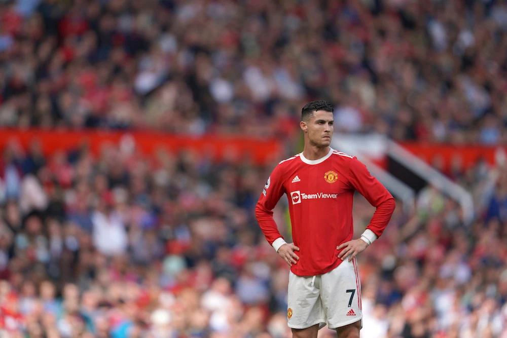 Manchester United's Cristiano Ronaldo stands on the pitch during the English Premier League soccer match between Manchester United and Norwich City. (AP)
