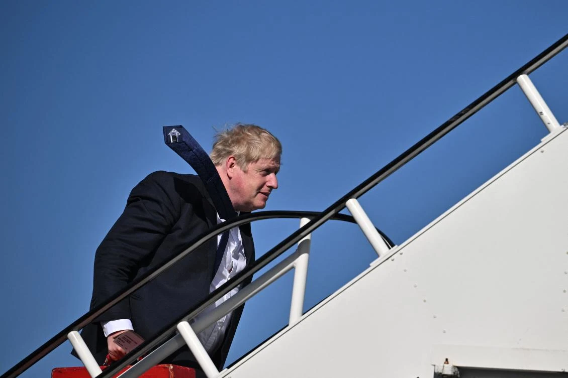 Britain’s Prime Minister Boris Johnson embarks on a plane at Stansted Airport, outside London, on Wednesday for a visit to India. (AFP)