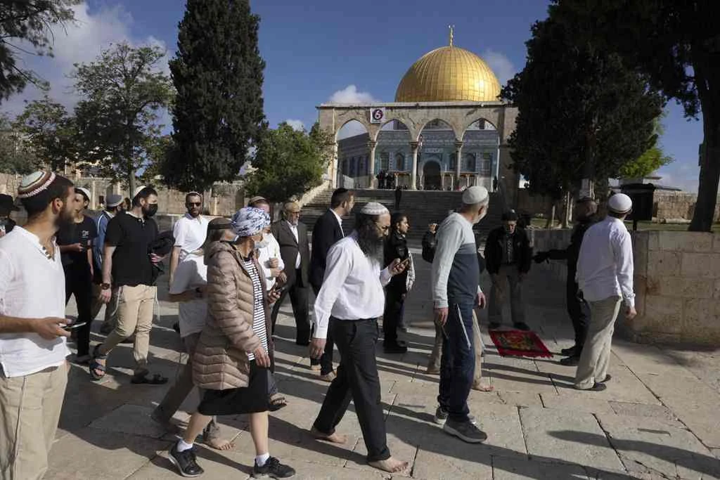 A group of religious Jewish men and women visit the Temple Mount, which is known to Muslims as the Haram Al-Sharif (The Noble Sanctuary) at the Al-Aqsa mosques compound in the old city of Jerusalem on Wednesday. (AFP)