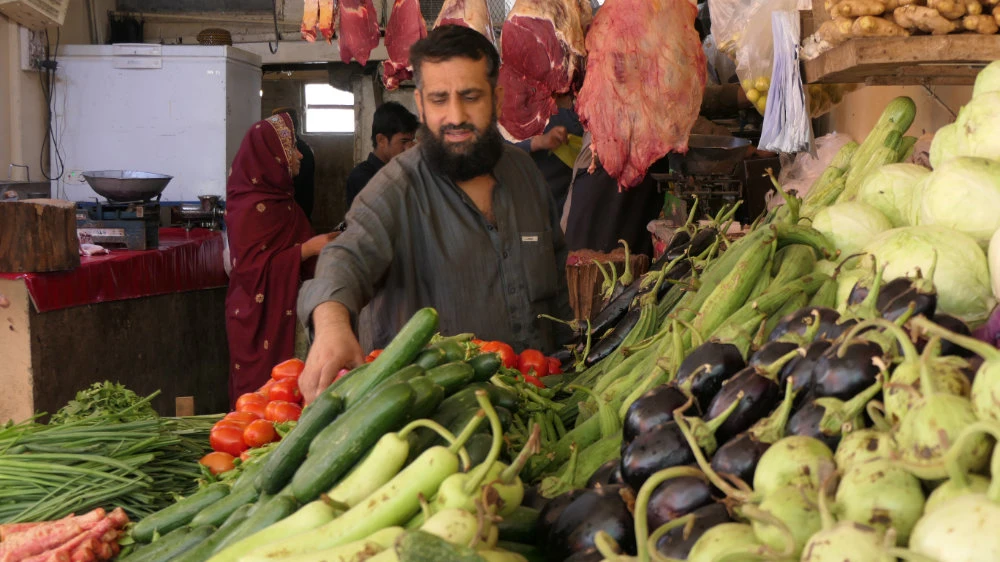 Haji Sultan Muhammad sells vegetables at his shop in the Sabzi Mandi vegetable market in Quetta, Pakistan, on April 20, 2022. (AN photo)