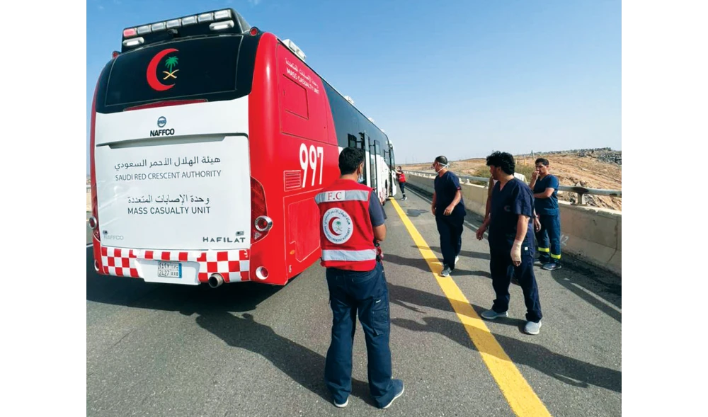 Paramedics from the Saudi Red Crescent are on the Al-Hijra Road in Friday morning, moments before the injured were taken to several hospitals in al-Madinah al-Munawwarah. (Supplied/ SRCA)