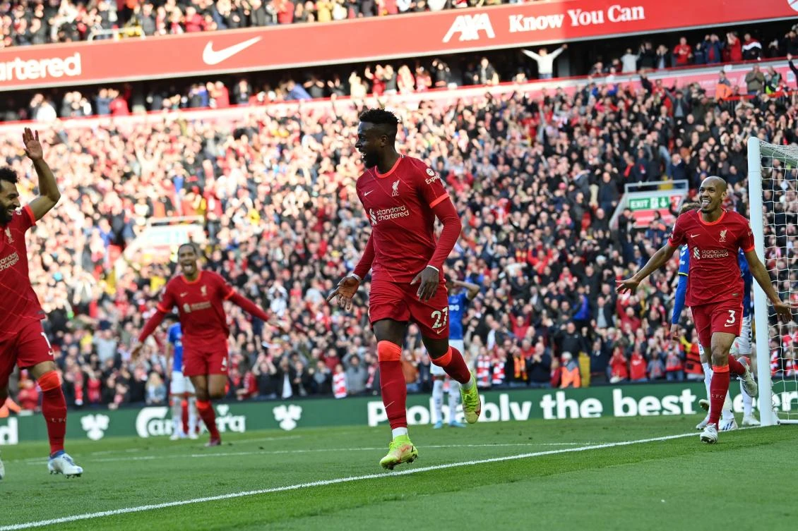 Liverpool's Belgium striker Divock Origi (C) celebrates scoring the team's second goal during the English Premier League football match between Liverpool and Everton at Anfield. (AFP)