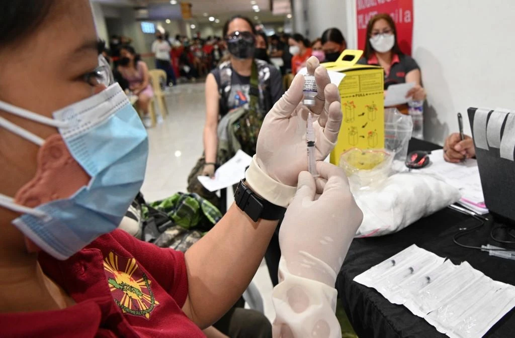 Nearly 61 percent of the Philippines’ 110 million population have been vaccinated, while nearly 13 million people have received first booster doses. (AFP)