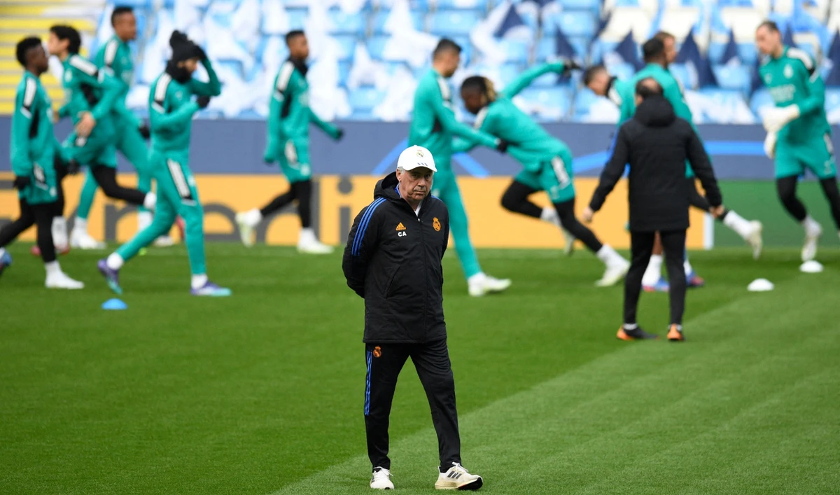 Real Madrid's coach Carlo Ancelotti leads a team training session at the Etihad Stadium in Manchester, on the eve of their UEFA Champions League semifinal first leg football match against Manchester City. (AFP)
