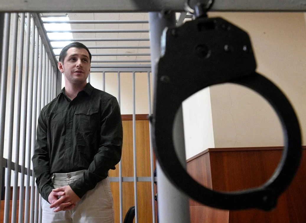 Trevor Reed stands inside a defendants’ cage during a court hearing in Moscow, Russia, Mar. 11, 2020. (AFP)