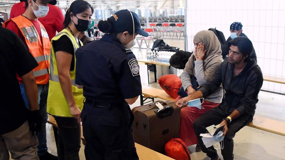 Afghan refugees are processed at Ramstein Air Base in Germany, Sept. 8, 2021. (AFP)