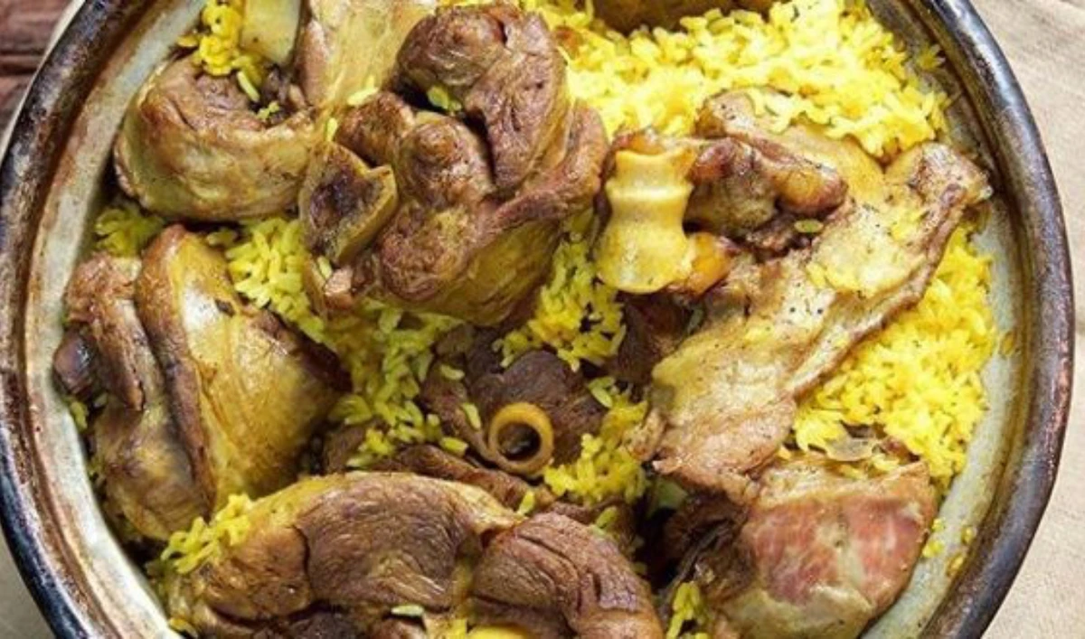 Qidra, a traditional dish from Hebron, is ready to be received by eager customers. (Supplied)