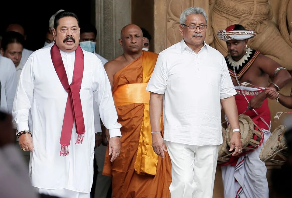 Sri Lankan Prime Minister Mahinda Rajapaksa, left, and his brother President Gotabaya Rajapaksa at Kelaniya Buddhist temple in Colombo, Sri Lanka, Aug. 9, 2020. (Reuters)