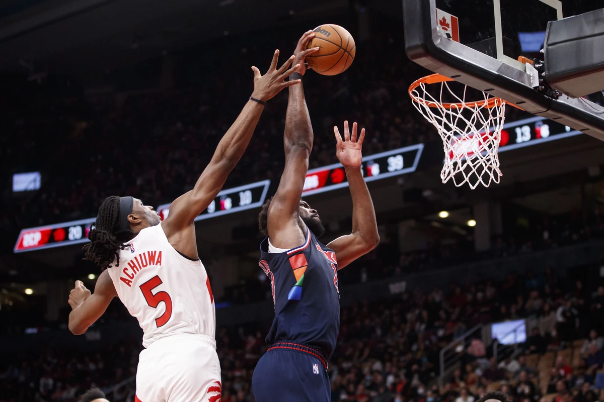 Joel Embiid of the Philadelphia 76ers dunks as Precious Achiuwa of the Toronto Raptors defends during Game 6 of the Eastern Conference First Round at Scotiabank Arena on April 28, 2022 in Toronto, Canada. (AFP)