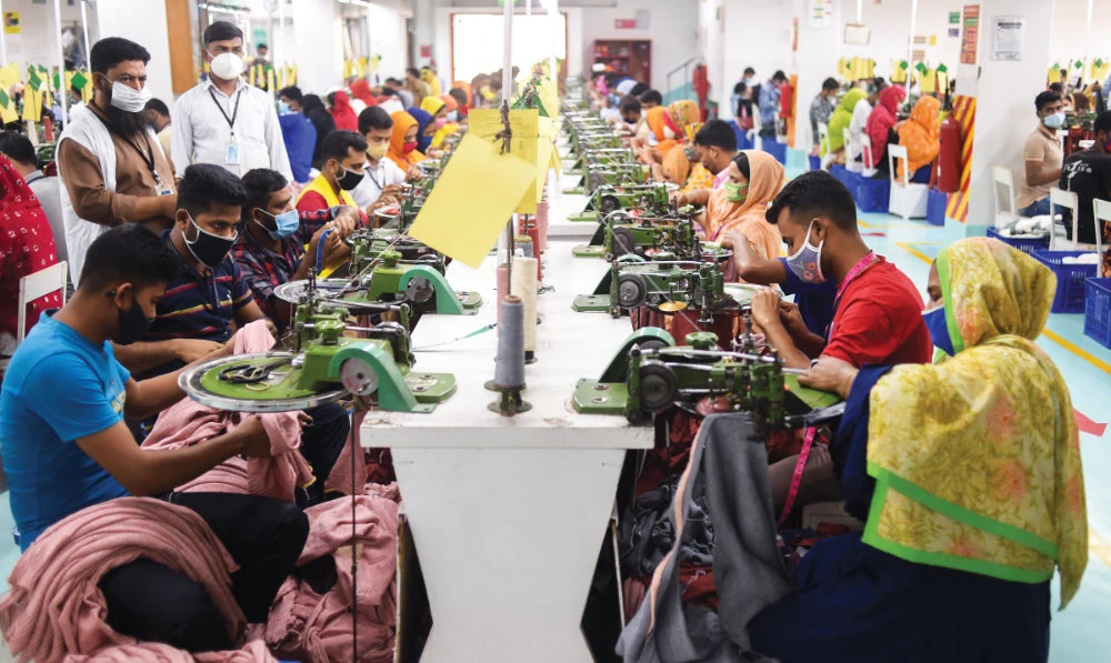 People work in a garment factory in Gazipur, Bangladesh. The textile sector contributes over 11 percent of the country’s gross domestic product. (AFP)