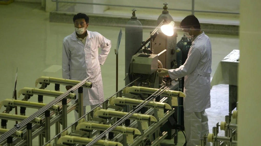 Iranian technicians working at a facility producing uranium fuel for a planned heavy water nuclear reactor, outside Isfahan, in 2009. (AP Photo)