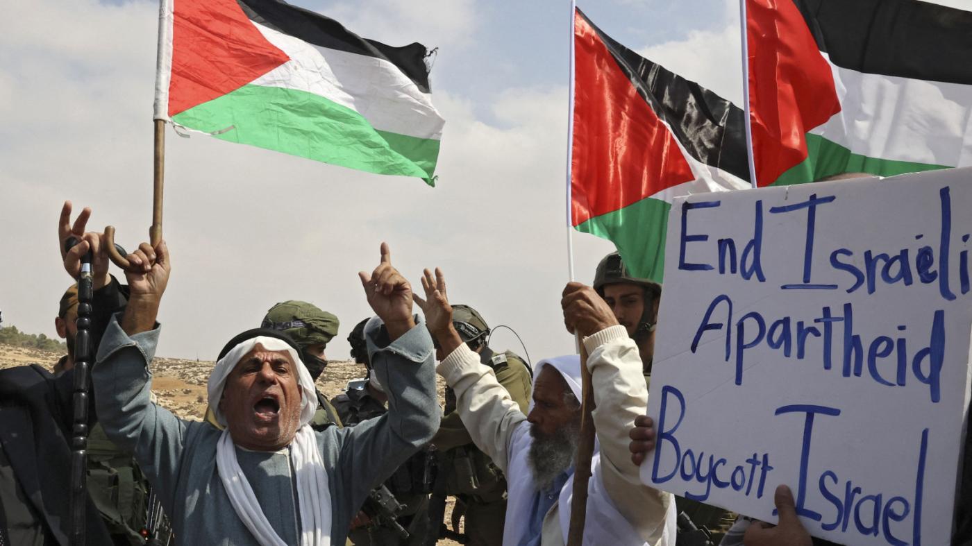 Elderly Palestinians protest against Israeli land confiscation in Hebron, West Bank, Oct. 2, 2021. (AFP)