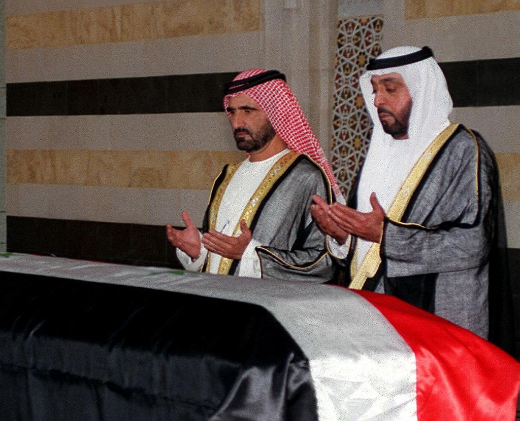 Sheikh Khalifa bin Zayed with Sheikh Mohammed bin Rashid, praying over the casket of late Syrian President Hafez Assad in Damascus 13 June 2000. (AFP)