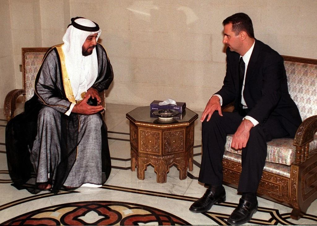 Sheikh Khalifa presents his condolences to Syrian heir apparent Bashar Assad on the sidelines of the funeral of President Hafez Assad's in Damascus 13 June 2000. (AFP)