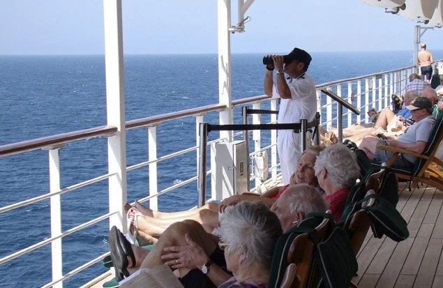 A lookout aboard the Queen Mary 2 scans the horizon for pirates in the Southern Red Sea, Jan. 24, 2013. (Reuters)