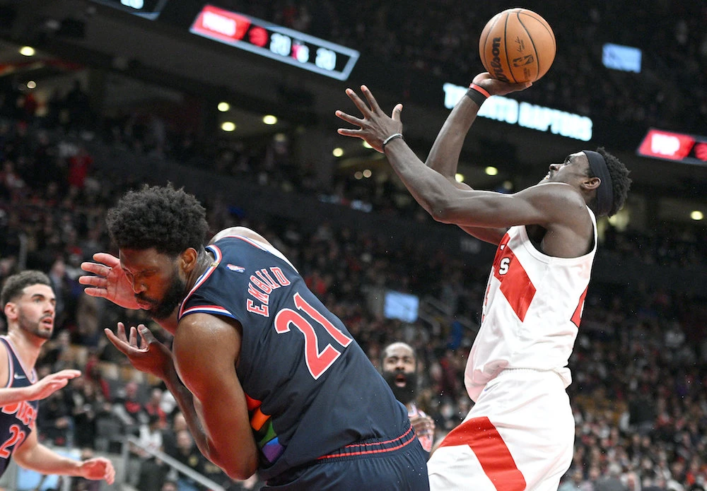 Philadelphia 76ers center Joel Embiid reacts after being elbowed in the face by Toronto Raptors forward Pascal Siakam during the first round for the 2022 NBA playoffs. (USA TODAY Sports)