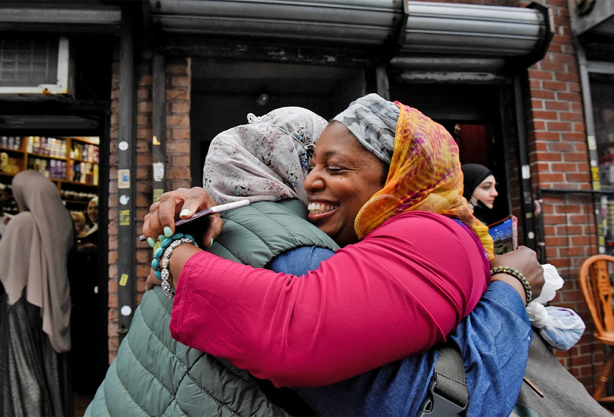 Women embrace as they celebrate Eid al-Fitr at the end of the holy month of Ramadan, at the Masjid At-Taqwa mosque, in the Brooklyn borough, in New York, U.S., on May 2, 2022. (REUTERS)