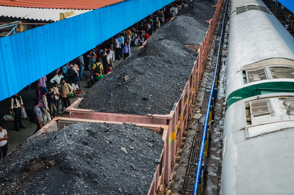 Delhi / India - Coal train waiting at station in India. (Shutterstock)