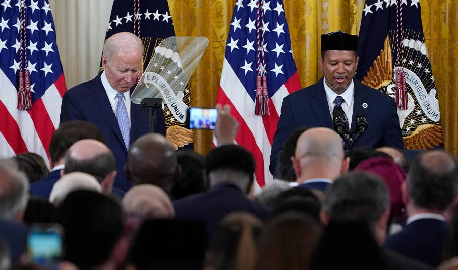 President Joe Biden, left, bows his head as Talib M. Shareef, right, President and Imam of the historic, Nation's Mosque, Masjid Muhammad in Washington, gives a prayer o celebrate Eid Al-Fitr in Washington, May 2, 2022. (AP)